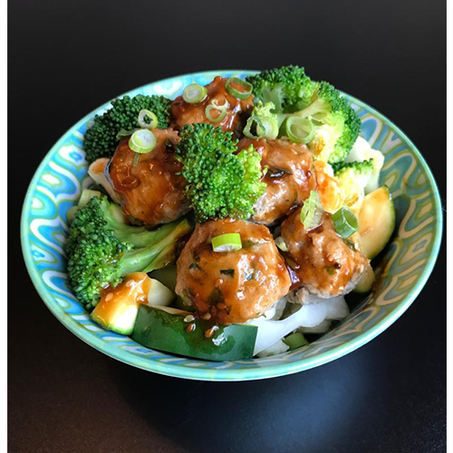 Meatballs in sticky sesame sauce with seasonal vegetables