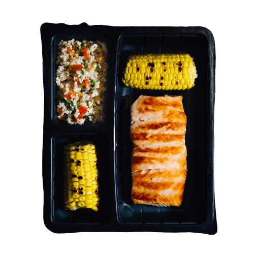 SALMON TROUT ON A PLATE WITH ROASTED CORN AND QUINOA