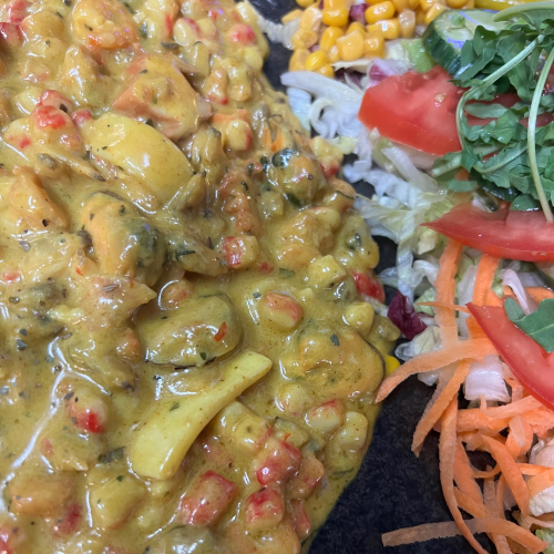 Zeevruchten in currysaus