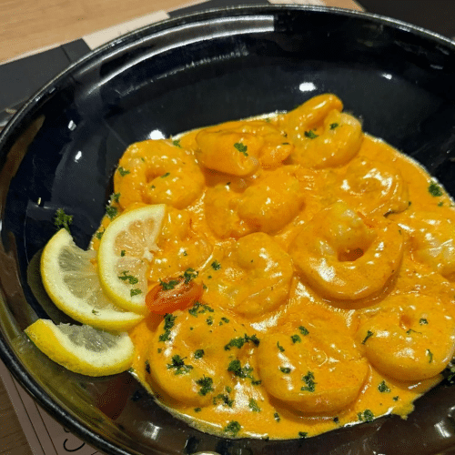 Scampis sauce crème ail (12 pièces) et frites