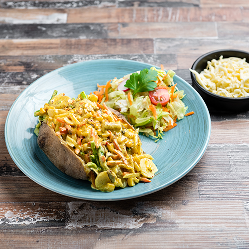 Kumpir kip wokgroenten currysaus