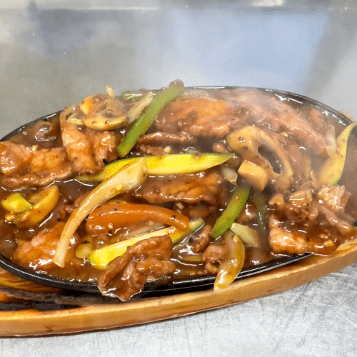 Rindfleisch an schwarzer Pfeffersauce (scharf)