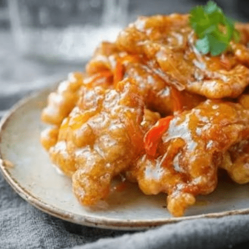 锅包肉 Frittierte Schweinefleischstücke in süss-saurer Sauce