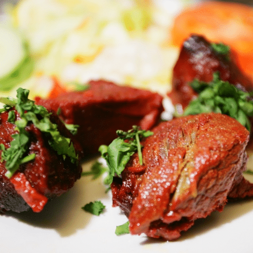 Lamm Tikka mit ein mal naan