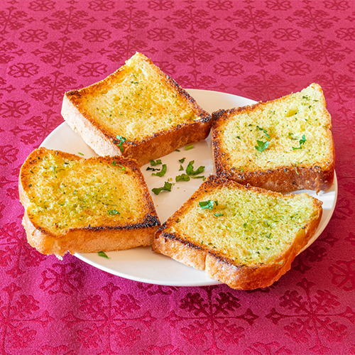 Knoblauchbrot (4 Scheiben, warm serviert)